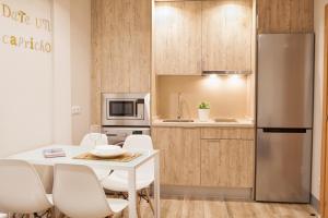 Kuchyňa alebo kuchynka v ubytovaní Apartamentos Boutique Salamanca