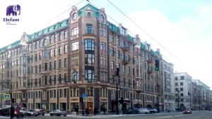 a large building on the corner of a city street at Elefant in Saint Petersburg