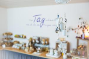 a shop with a counter with a lot of items at Hotel Burgblick in Thallichtenberg