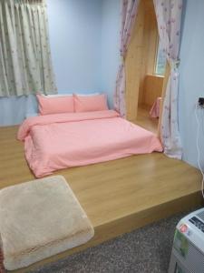 Postel nebo postele na pokoji v ubytování Shuanghu Garden B&B