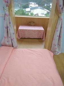 Postel nebo postele na pokoji v ubytování Shuanghu Garden B&B