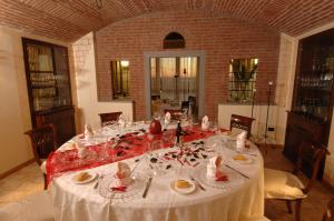 a table with a white table cloth on it at Hotel Fontana Santa in Grumello del Monte