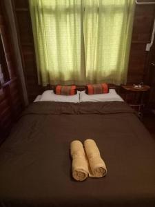 Un pat sau paturi într-o cameră la JJ at Chiangkhan