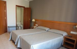 Postel nebo postele na pokoji v ubytování Hotel Inglés + 23 fotografií