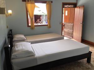 Postel nebo postele na pokoji v ubytování Golden Hill Guesthouse