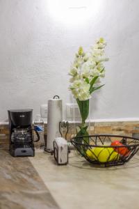 Příslušenství pro přípravu čaje a kávy v ubytování Merida Serviced Apartments
