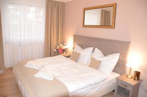 Posteľ alebo postele v izbe v ubytovaní Resort Erich
