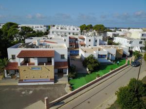an overhead view of a city with white houses at Apartamentos Mar y Sal in La Savina