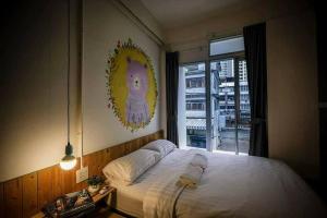 Postel nebo postele na pokoji v ubytování Pastelhouse hostel
