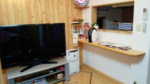 TV a/nebo společenská místnost v ubytování Villa M Guesthouse