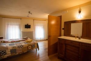Postel nebo postele na pokoji v ubytování B&B da Toi + 11 fotografií