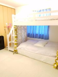 Postel nebo postele na pokoji v ubytování Villa M Guesthouse