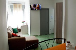 TV a/nebo společenská místnost v ubytování Il Centenario