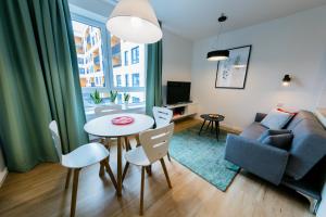 Televízia a/alebo spoločenská miestnosť v ubytovaní Mojito Apartments - Botanica II