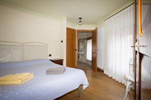Postel nebo postele na pokoji v ubytování B&B da Toi