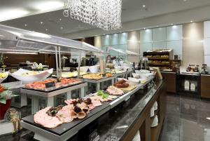a buffet line with many different types of food at Eurostars Berlin in Berlin