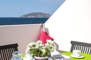 a table that has some food on it at Residence Scirocco e Tramontana in Favignana