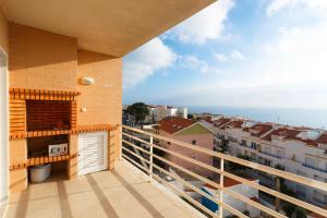 a balcony with a view of a city at WHome | Ericeira Luxury Apartment in Ericeira