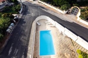 an overhead view of a swimming pool in a road at WHome | Ericeira Luxury Apartment in Ericeira