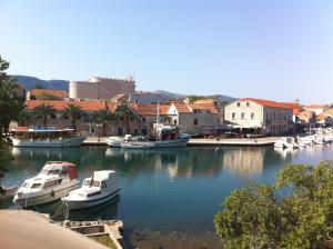 a group of boats are docked in a harbor at Apartments Renato in Vrboska