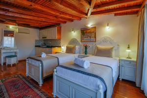 a bedroom with two beds and a kitchen at La Paloma Hotel in Antalya