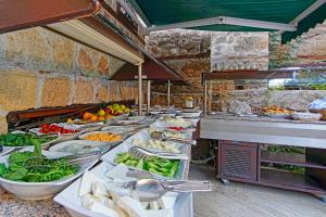 a buffet line with many different types of food at La Paloma Hotel in Antalya