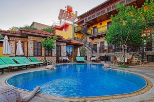 a large swimming pool in the middle of a building at La Paloma Hotel in Antalya
