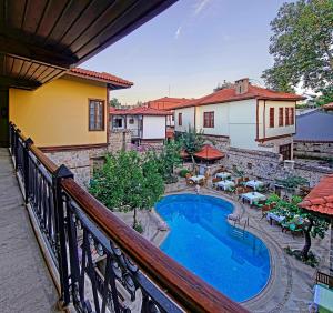 a view of a swimming pool from a balcony at La Paloma Hotel in Antalya