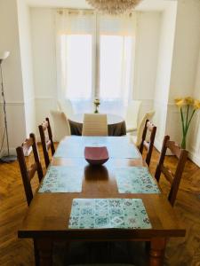 a dining room table with a bowl on top of it at Appartment Le Charme du Bourgeois in Nice
