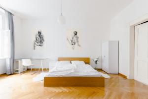 Postel nebo postele na pokoji v ubytování Kubelíkova Apartments