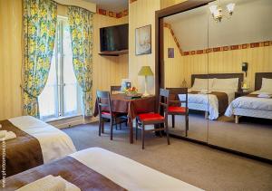 Postel nebo postele na pokoji v ubytování Le Chalet Montégut