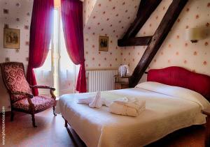Postel nebo postele na pokoji v ubytování Le Chalet Montégut