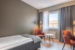 Postel nebo postele na pokoji v ubytování Quality Hotel Grand Kristianstad