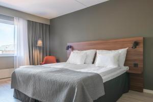 Postel nebo postele na pokoji v ubytování Quality Hotel Grand Kristianstad