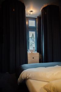 Postel nebo postele na pokoji v ubytování Auberge de l'Abbaye