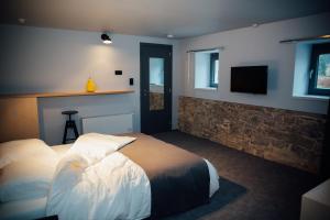 Postel nebo postele na pokoji v ubytování Auberge de l'Abbaye