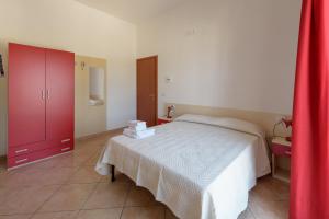 Postel nebo postele na pokoji v ubytování B&B Rose Villa