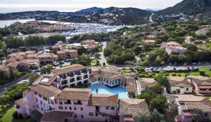 a small town with houses and trees at Colonna Park Hotel in Porto Cervo