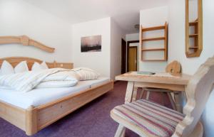 Postel nebo postele na pokoji v ubytování Garni-Appartement Collina