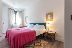 Posteľ alebo postele v izbe v ubytovaní Apartamentos RG Dúplex San Bernardo