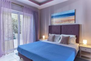 Posteľ alebo postele v izbe v ubytovaní Nymphes Luxury Apartments
