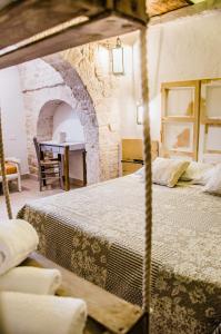 A bed or beds in a room at Trulli Soave
