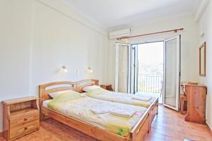 Ένα ή περισσότερα κρεβάτια σε δωμάτιο στο Katerina House +8 φωτογραφίες