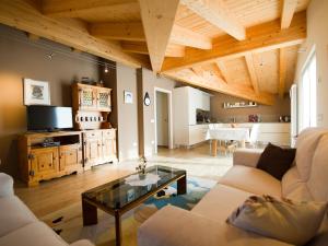a living room with a couch and a coffee table at Casa Reit in Bormio