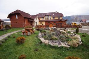 a large house with a garden in front of it at Panorama Yasinya in Yasinya