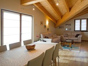 a living room with a table and chairs at Casa Reit in Bormio