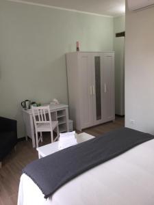 Postel nebo postele na pokoji v ubytování Bomarosa B&B