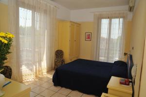 Postel nebo postele na pokoji v ubytování Hotel Salus
