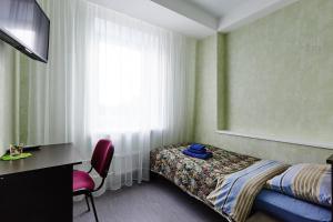 Кровать или кровати в номере Отель Петровский