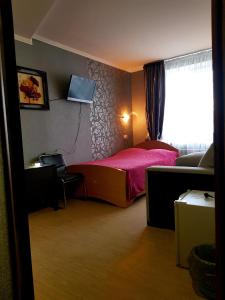 Postel nebo postele na pokoji v ubytování Hotel Om Shanti
